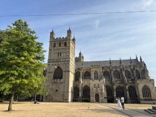 In the interplay of light and shadow in the ancient city of Exeter, one can hear the whispers of time.