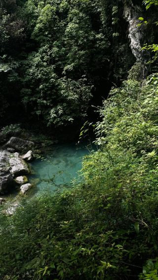 The green pools and cascading waterfalls are nestled among the mountains of Tianyi Valley in Guang'an, Sichuan