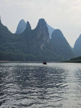 Discovering Xingping’s Stunning Li River: A Quick Guide 🚤🌄  
If you’re craving those wild Instagrammable landscapes, Xingping in Guangxi is the place. The Li River here is legendary: endless Karst mountains, dramatic scenery, and peaceful villages.

Top Spots to Visit:
· Li River Scenic Area (Xingping Pier, open daily, 8am–6pm): The “20 Yuan Note View” is just a short walk east, and the panorama is seriously epic! Best time for photos? Early morning—mist rolls over the peaks and you’ll avoid tour crowds.
· Laozhai Hill (next to Xingping Ancient Town): This steep but short hike rewards you with totally insane sunset views. Wear good shoes—it gets slippery, but the payoff is next-level.
· Xingping Ancient Town: Wander the little side streets for rustic vibes and grab street snacks (try the local rice noodles at “Lao Xingping Mian Dian”).

Tips:
· Bring a light jacket—even in summer, river breezes can get chilly at dawn.
· Skip the big river cruises (can be pricey); hire a small bamboo raft at Xingping Pier for a quieter, cheaper trip—just negotiate in advance!  
· Cash is king in smaller shops and for raft rides.

Getting Around:
· Buses run from Yangshuo to Xingping every 30 minutes, ~40 mins ride.
· In town, everything’s walkable or rent a bike for longer exploring.

Food:   
Local spots serve up fresh river fish ("beer fish" is a must-try at Xingping’s little eateries). Hit “Yuan Xiang Restaurant” for flavorful local dishes.

Essential Info:
· No visa extension service in Xingping.
· Weather: Summers are hot and humid, but mornings are cool.
#LiRiver  #Xingping  #ChinaScenery  #TravelTips  #Tripcom 
