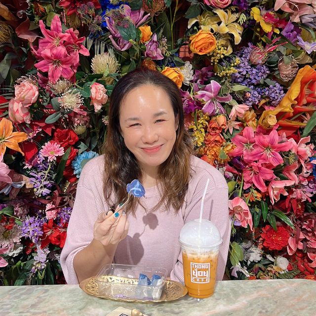 Enjoying Thai Sweets surrounded by flowers