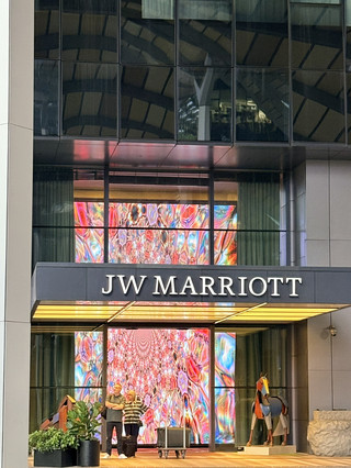#springflower
At the intersection of heritage and innovation on Singapore's Beach Road, the JW Marriott Singapore South Beach redefines urban luxury. This iconic hotel seamlessly integrates conserved 1930s military buildings with futuristic architecture by Norman Foster, creating a visual dialogue between past and future. Guests wake up to curated art pieces in sleek rooms featuring Nespresso machines and rainfall showers, before heading to the 18th-floor infinity pool where Marina Bay Sands and the Singapore Flyer stretch across the horizon. When hunger strikes, Beach Road Kitchen tempts with live stations serving chili crab and laksa, alongside international fare. The hotel's prime location puts you steps from the vibrant Kampong Glam district, famous for its Malay heritage and hip cafes, while direct underground access to Esplanade MRT makes exploring effortless. Whether you're catching a musical at the nearby Esplanade Theatre or attending a conference in the hotel's massive column-free ballroom, every stay here balances work, play, and pure indulgence against Singapore's dazzling skyline.