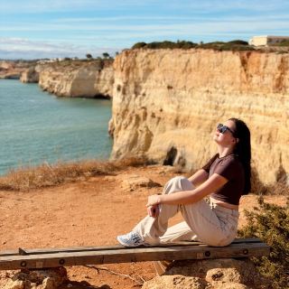 Jaw-dropping coastal drama awaits on the Seven Hanging Valleys Trail—think dramatic cliffs, hidden beaches, and surreal sea views 🌊☀️. This is one of Europe’s top hiking routes, stretching from Praia da Marinha to Praia de Vale Centianes.

Start at Marinha Beach viewpoint (Praia da Marinha 8400, Lagoa) for sunrise—park early, as the lot fills up fast. The rocky terrain means sturdy shoes are a must, with thickets and twists at every turn but non-stop panoramic eye-candy. As you trek, don’t miss Benagil Cave (Cm1154 | Praia de Benagil, Benagil, Lagoa 8400)—peer down through the famous skylight from above, or, if you want to fully experience it, join a SUP/kayak tour to swim inside and catch sandy rays. For a swim break, hit Praia de Benagil (Estrada de Benagil, Lagoa 8400-427). The water’s irresistibly clear—pack swimwear and a towel for a dip.

Keep fueled and hydrated—no shops on the way! Be sure to pack snacks and water for the day. The wild natural paths mean slower going, so allow a full day and pace yourself. If you finish at sunset in Carvoeiro, catch a Bolt taxi back to your starting point—it’s the easiest exit after a long hike.

On the route, look for classic shots: those cliff’s-edge panoramas at sunrise, Benagil cave from above, and whitewashed Carvoeiro at dusk—all totally Insta-worthy. Beware loose rocks and mind your step—nature’s beauty here is raw and untamed.

Travel tips:
🥪 Bring snacks & water — along the trail there are no shops or cafés
🕒 Plan a full day — this hike deserves time without rushing
👙 Take a swimsuit & towel — for a refreshing swim on the way
👟 Wear comfortable hiking shoes — the terrain can be tricky
🔋 Charge your phone — you’ll want lots of photos & videos
🧴 Use sunscreen — the sun here is serious, especially on the cliffs

✨ One of the most beautiful coastal hikes in Portugal - be prepared and enjoy every step!

#falladventures #Algarve #SevenHangingValleys #CoastalHiking #EuropeNature #TravelTips 