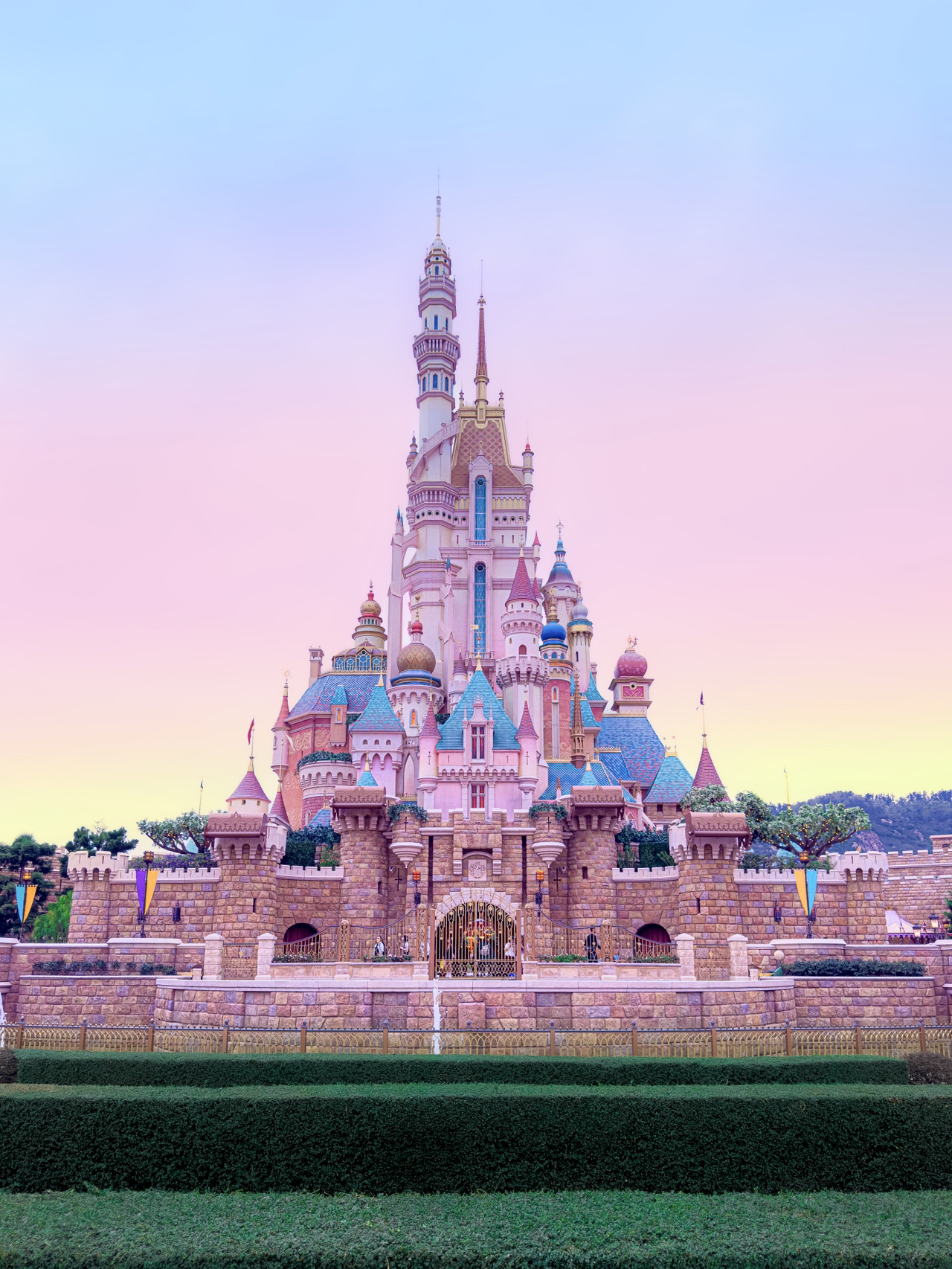 There is something magical about stepping into Hong Kong Disneyland. It truly feels like walking straight into a fairytale. Even on a cloudy day, the mix of dreamy castles, lakeside views, and small boats on the water makes the whole place look like a movie set come to life.

Start your day on Main Street, U.S.A., where the vintage storefronts and Victorian details create perfect backdrops for photos. Then head to the Castle of Magical Dreams and try catching it at dusk when the lights begin to glow against the cloudy sky. It is one of the most beautiful sights in the park.

Do not miss Arendelle: World of Frozen. The Norwegian-style rooftops and boat-themed details are stunning. For the best photo, stand near the water and capture the reflections of the village and castle under the moody Hong Kong skies.

When it is time for a break, enjoy a treat from one of the themed cafés or explore the rides in Adventureland. If you visit on a rainy day, which is quite common, focus on indoor attractions and bring a light rain jacket instead of an umbrella so your hands stay free for photos and snacks.

Tips:
Arrive about 30 minutes before opening for smaller crowds and easier photos.
Check the daily schedule before you go, as hours can change frequently.
Weekdays are usually less busy if you want to avoid long lines.
Admission: HKD 559
Address: Hong Kong Disneyland Resort, Lantau, Hong Kong

#HongKongDisneyland #DisneyMagic #TravelHongKong #ThemeParkDays #TravelDiaries
