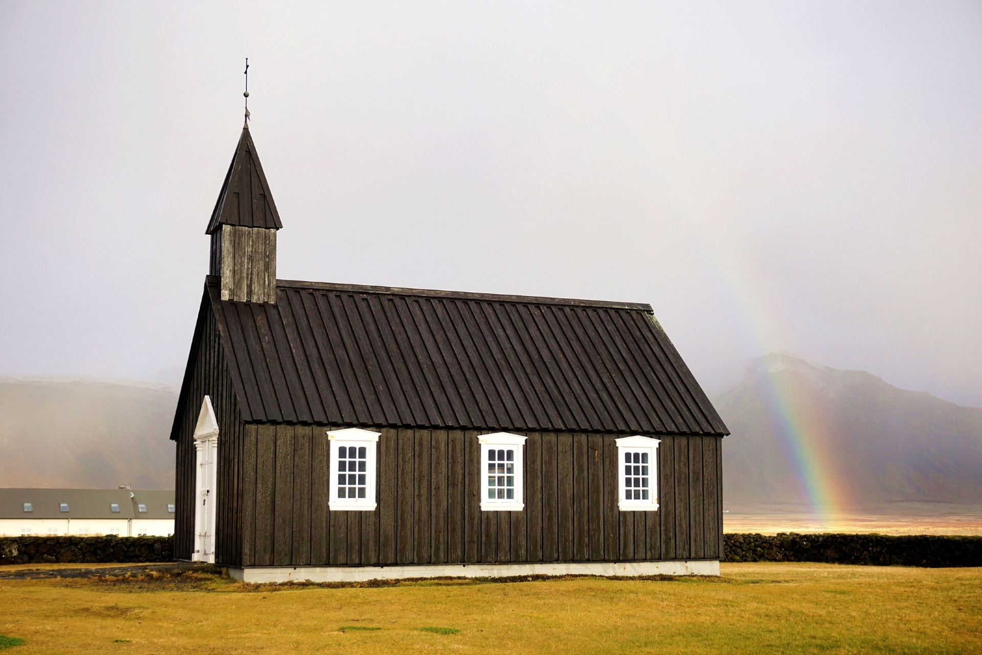 ​[Iceland - Búðakirkja] Worth the Detour! Rainbow and Angel Rays in Front of the Black Church.