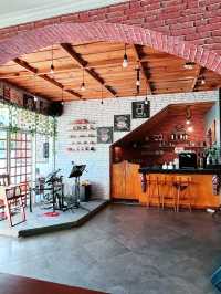 Kedai Teres Parapat: Cozy Orange-Hued Café with Aromatic Coffee & Weekend Vibes 