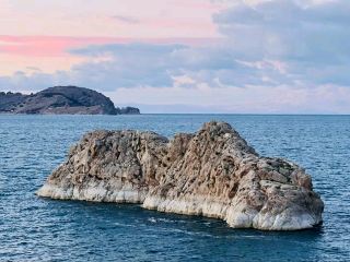 #winterescape Discover Gevaş’s Scenic Blend: Stadium Vibes & Nature Magic 🌄🌊

Set on the edge of Lake Van, Gevaş brings together dramatic landscapes and local spirit with Gevaş Stadyumu—a surprisingly photogenic spot for both sports fans and view seekers! From sunrise to sunset, this lakeside town is a canvas of snow-capped mountains, vibrant sunsets, and authentic Turkish cultural sights.

Here’s how to make the most out of your Gevaş experience:
Start your day early at Gevaş Stadyumu (Karşıyaka, 65700 Gevaş/Van)—the locals cheer here and the morning light on the empty stands, with a backdrop of Van’s snow mountains, makes for an amazing “stadium meets nature” snap. Stick around as the sun rises above the nearby lake for the most magical golden hour.

Don’t miss wandering the lakeside; you’ll catch fishermen at work and admire the outdoor scenery reflecting on Lake Van. It’s ideal for sunrise and sunset photo ops—look for creative perspectives framing the snow peaks with the sparkling water. For lunch, pop into a local eatery and try a traditional Van breakfast; plates decorated with floral patterns against a black backdrop make for a unique flat-lay food photo—definitely hashtag-worthy!

Key tips: The weather can turn fast—pack a light waterproof jacket and sturdy shoes for lakeside walks. Early mornings and late afternoons offer the best lighting and fewer crowds, plus the local vibe’s more relaxed. Stadium events or matches pop up, so check ahead for access.

#Van #Gevaş #NatureVision #TurkeyTravel #ScenicSpots