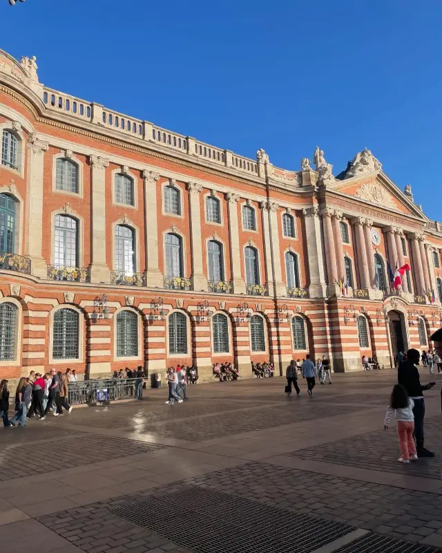 "Place du Capitole: A Pink Dream Interwoven with Time" 