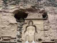 A 1600-year-old site on Yellow River with 183 caves and niches, 694 stone statues