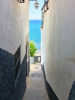 🌊 A Hidden Stairway to the Sea in Marshan, Tangier 🇲🇦.

📍 Location: Marshan, Tangier, Morocco

There’s another side of Tangier waiting beyond its famous landmarks.
Hidden among the whitewashed buildings of Marshan, narrow stairways wind between traditional walls and lanterns before opening toward the blue Mediterranean. 🌊
What makes this corner special is the feeling of discovery — one moment you're walking through a quiet local lane, and the next, the sea appears perfectly framed between the buildings.
From the surrounding streets, you can also enjoy beautiful views across Tangier’s coastline, harbor and hills. It’s a simple but memorable way to experience the city away from the busiest tourist spots.

📸 If you enjoy discovering authentic corners of a city, put Marshan on your Tangier list.

Would you walk down this hidden stairway if you discovered it in Tangier? 👀🌊

#Tangier  #Marshan  #TangierMorocco  #MoroccoTravel  #VisitTangier  #ExploreTangier  #Morocco  #NorthMorocco  #HiddenGems  #TangierViews  #Mediterranean  #MoroccanArchitecture  #TravelPhotography  #TravelMorocco  #DiscoverMorocco 