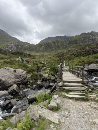 
Snowdonia National Park is one of the most stunning corners of the UK, with dramatic mountains, glacial lakes, and rolling green valleys as far as the eye can see. Mount Snowdon itself (Yr Wyddfa) is the highest peak in Wales, and whether you hike up or take the little mountain railway to the summit, the views are absolutely worth it.

The weather can change quickly, so it adds to the adventure — one moment misty and moody, the next bright sunshine lighting up the hills. The countryside feels wild and unspoiled, with charming stone villages, sheep grazing on the hillsides, and waterfalls tucked away along the trails.

What made the trip even better was the people — genuinely friendly, welcoming, and happy to share tips on the best walking routes or a good local spot for food. It’s the kind of place that stays with you long after you leave, and I’d recommend it to anyone who loves nature, hiking, or just a slower pace surrounded by beautiful scenery.