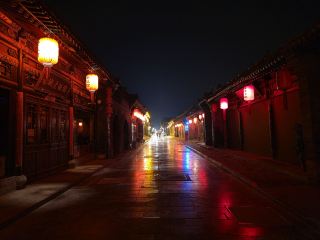 Pingyao ancient city is such a cool place! I made a stop here traveling from Beijing to Xi'an and it was absolutely worth it. 

I love the beauty of these old buildings. In my opinion it looks especially stunning at night. When most of the stores close, it gets pretty quiet and empty, perfect for taking pictures. Make sure you book a room in one of the courtyard hotels, they are very charming.

I think just staying here for one or two nights is enough to see most of the places though and you can easily walk around the area as it's not that big. The town is also car free.