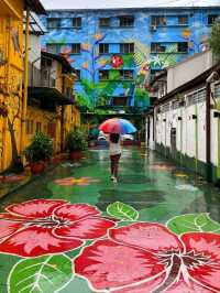 Be surrounded by murals at Jalan Alor