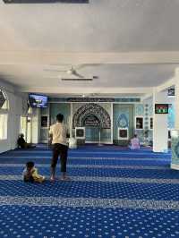 The mosque features intricate Islamic calligraphy 