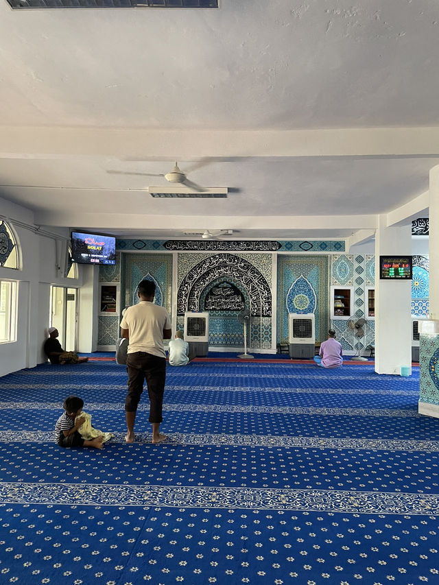 The mosque features intricate Islamic calligraphy 
