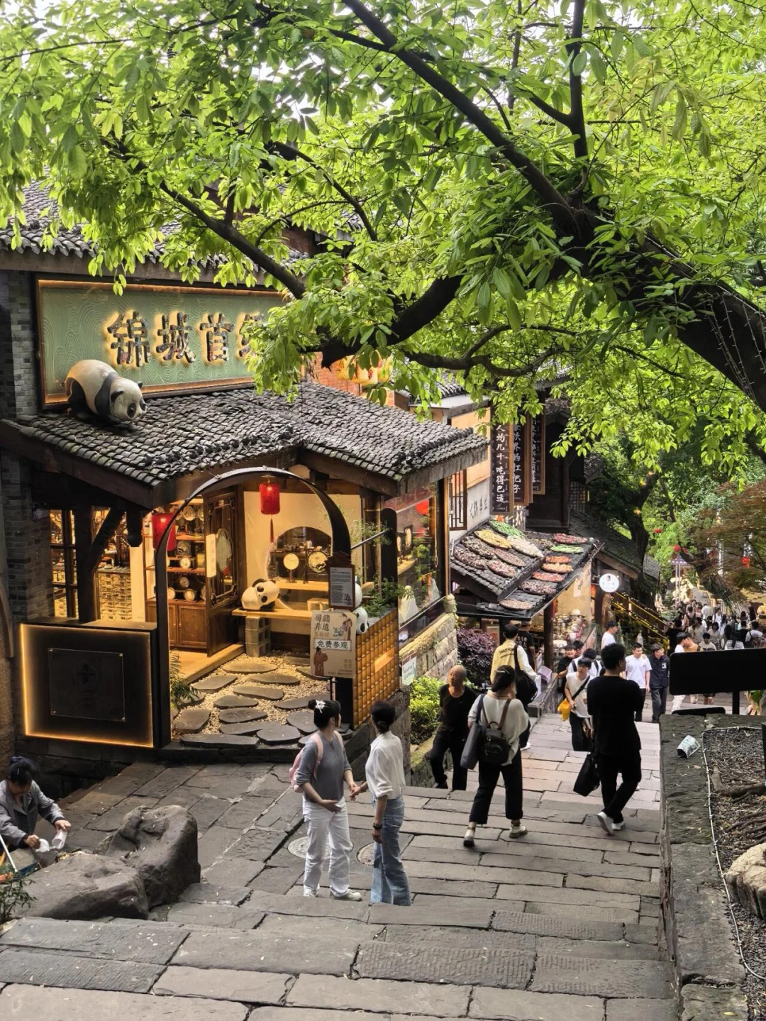 If you're heading to Chongqing and want to experience that authentic "Mountain City" vibe without walking your legs off, definitely save this post! 😆

📍 Shancheng Alley (Mountain City Alley)

It's recently become super popular again thanks to the Lantern Festival 🏮
But a quick heads-up... if you enter the "wrong way", it's going to be exhausting! 😂

✅ How to explore without killing your legs
🚇 Take Metro Line 1 to Qixinggang Station, Exit 1.
Walk over to "Lingshi Alley" (near Jiashi Nursing Home) and start your stroll right from here.

✨ The best part? It's "downhill all the way!"
No need to climb endless stairs, making it perfect for kids, older folks, or anyone who just wants a chill walk.

📌 Recommended Route
Lingshi Alley Entrance → Ren'ai Church → Wilderness Garden → Cliffside Plank Road → Houlu → Shancheng Alley Main Street → Zhongxing Road Exit

❌ Pro tip: Do NOT start from "Zhongxing Road"
Otherwise, you'll be signing up for a massive uphill hike 🥲

📸 Must-Visit Photo Spots
🏛 Former Site of Ren'ai Church
An old French-style building with a vintage vibe. The natural lighting here is stunning, especially during the daytime.

✨ Wilderness Garden
The sparkling yellow stars corner is absolutely gorgeous. Your photos will turn out amazing 🌟

🏠 Houlu
A Republic of China-era style building with a cool retro feel. Perfect for shooting aesthetic portraits!

🏮 Love Alley
An alleyway filled with red lanterns. It has a very local vibe that captures the essence of Chongqing perfectly.

🐼 Traveling with kids? Don't miss this!
There's a Panda HuHu IP store with an adorable panda theme.
The dessert menu is incredibly cute, and the kids will absolutely love it 🥹

📱 Tips to avoid getting lost
Search for these WeChat mini-programs:
"重庆山城巷" (Chongqing Shancheng Alley) or "山城步道电子地图" (Shancheng Trail Digital Map).
They include full maps, check-in spots, and complete navigation!

💡 Good to Know

· Wear comfortable shoes since most of the paths are made of stone.
· Entry is completely free 💸
· You can continue your walk straight to Shibati (Eighteen Flights of Stairs) or Jiefangbei (Liberation Monument).

✨ Summary: An all-in-one spot offering old city views, cafes, incredible photo corners, and full-on Chongqing vibes—all without tiring yourself out! 📷🏮