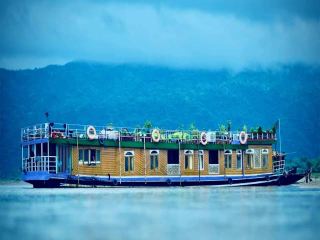 Tanguar Haor — The Symphony of Freshwater and Freedom 🌊✨
The Tanguar Haor in Sunamganj feels like stepping into a vast, liquid mirror where the sky bends down to touch the earth. Spanning across miles of serene wetlands, this majestic Ramsar site offers a raw, unfiltered escape into nature, surrounded by the emerald backdrop of the Meghalaya hills.
Wake up to the gentle rocking of a traditional wooden houseboat, watch the morning mist dance over the pristine waters, and witness the sky ignite in brilliant hues of gold and crimson at sunset.
Top Things to Experience:
· Houseboat Cruising: Spend a night or two on a premium wooden boat, drifting lazily across the endless water under a canopy of bright stars.
· Watchtower Viewpoint: Climb the watchtower at Niladri Lake (Shaheed Siraj Lake) to gaze at the striking turquoise water framed by majestic green borders.
· Jadukata River & Shimul Bagan: Take a detour to ride through the crystal-clear currents of the Jadukata River and stroll through the nearby mesmerizing silk-cotton tree forest.
· Fresh Local Feast: Savor authentic haor delicacies, from freshly caught local fish curry to traditional duck bhuna cooked right on the boat.
Escape the chaos of the city and lose yourself in the endless horizons where the water tells a different story with every wave. 🛶💚