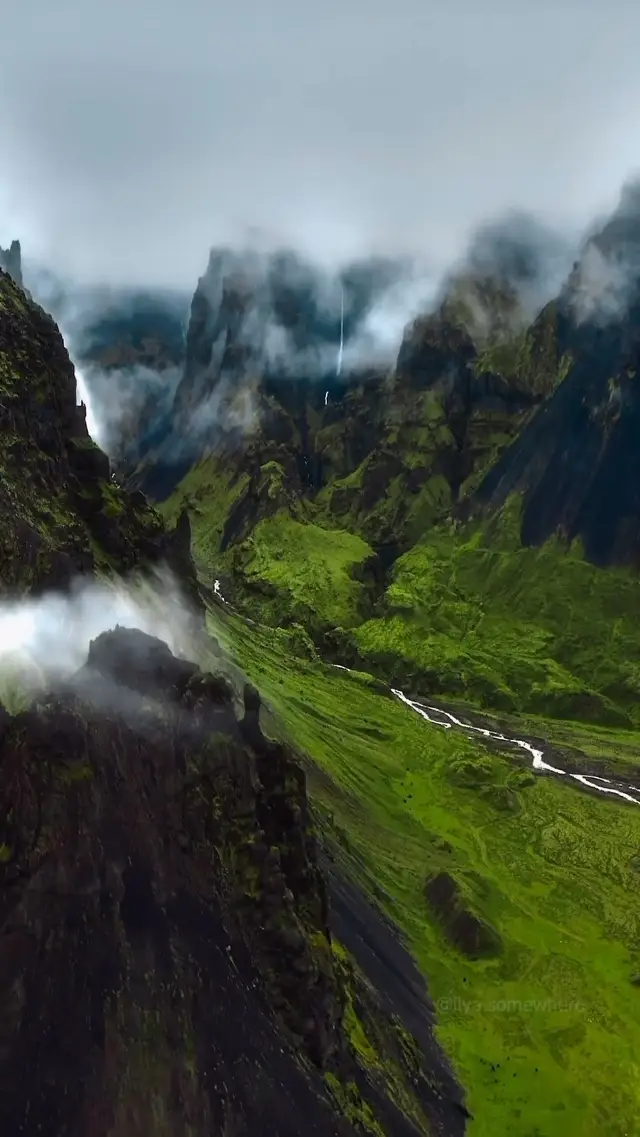 Flying across the green scenery of the mountains of Iceland