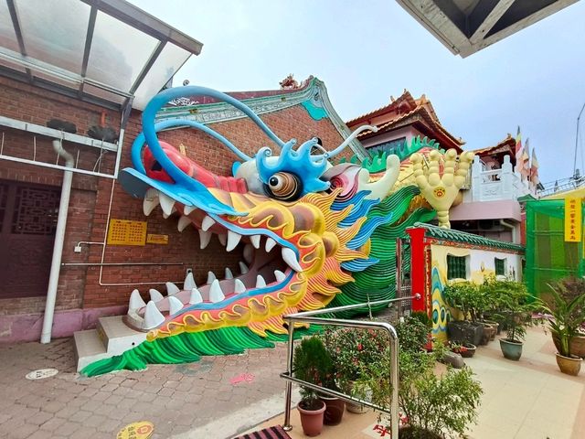 Whimsical Wonders: Discover the Majestic Dragon Sculpture at 8 Chinese Temple Village