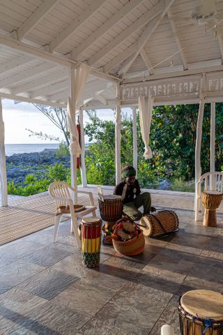 Drumming, Jerk, Shopping, Paddle Boarding, and Cliffside Dining in Negril