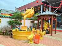 Whimsical Wonders: Discover the Majestic Dragon Sculpture at 8 Chinese Temple Village