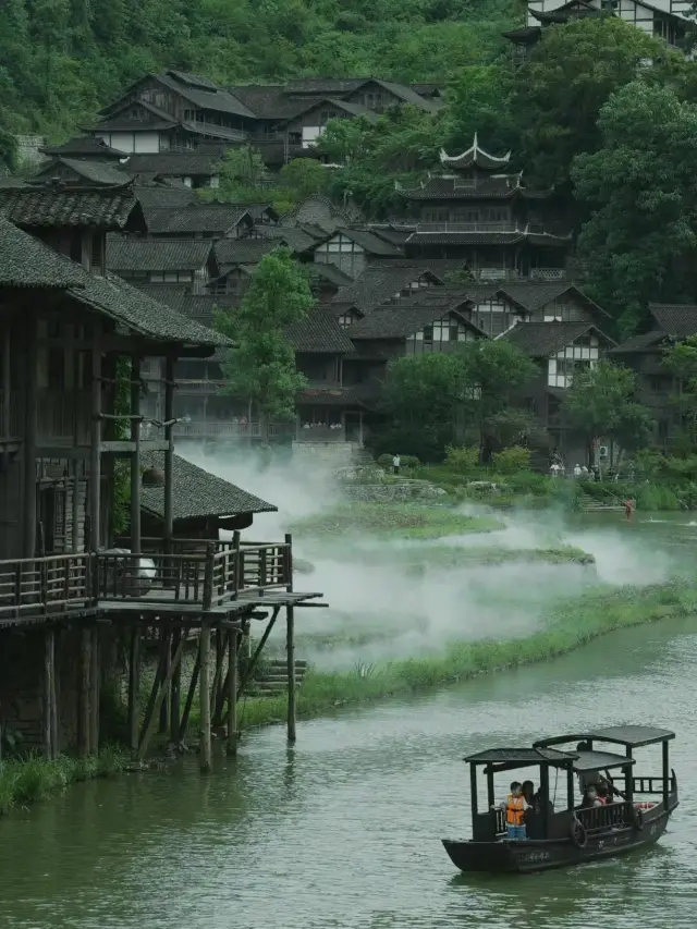 The water is cold and the river is quiet, with green mountains filling the view