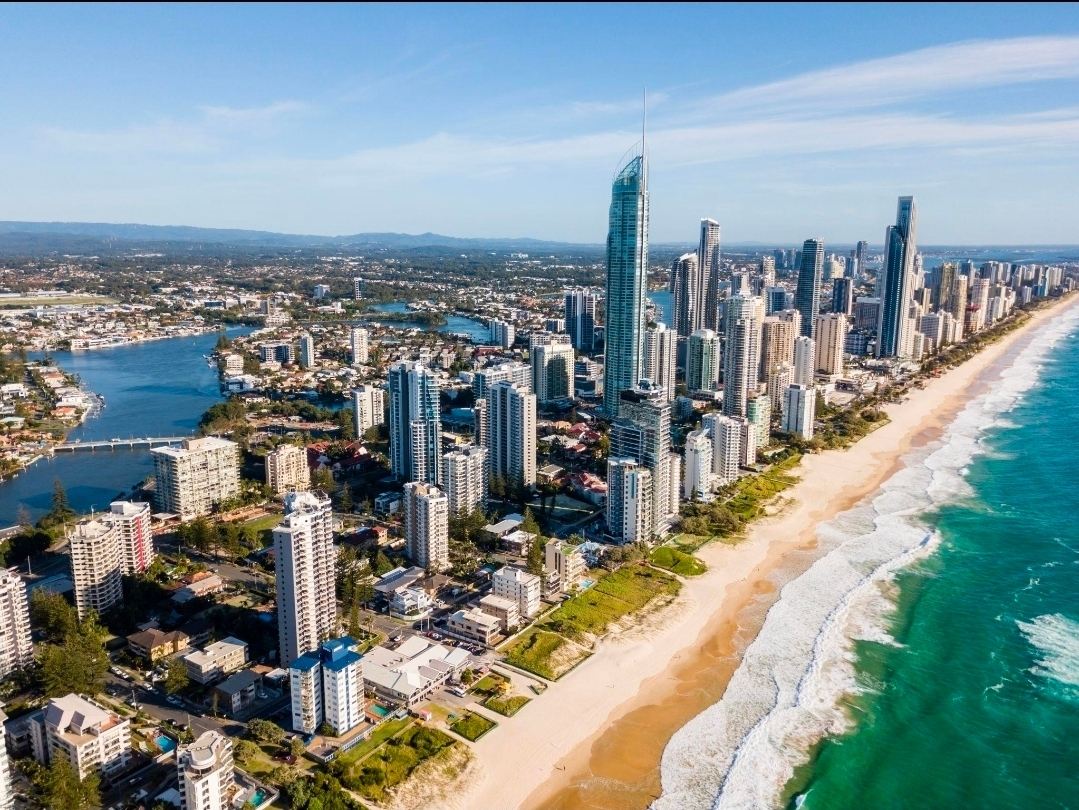 Gold Coast, Australia — Where Golden Beaches Meet a Modern Skyline

Stretching along the sparkling Pacific Ocean in Queensland, the Gold Coast is one of Australia’s most captivating coastal destinations. Famous for its long golden beaches, rolling surf, and impressive skyline, this vibrant city beautifully blends seaside relaxation with modern city life.

Surfers Paradise is the heart of the Gold Coast, where high-rise buildings stand beside a sweeping sandy beach. Visitors can enjoy oceanfront cafés, shopping, coastal walks, and spectacular sunsets. For a more laid-back atmosphere, Burleigh Heads offers beautiful beach views, scenic walking trails, and a charming local dining scene.

Beyond the coastline, the Gold Coast has plenty to explore. Take in panoramic views from SkyPoint Observation Deck, visit the family-friendly theme parks, or discover the lush rainforests and waterfalls of the hinterland. Nearby highlights include Broadbeach, Currumbin Wildlife Sanctuary, and Burleigh Heads National Park.

Whether you’re seeking adventure, relaxation, or unforgettable coastal scenery, the Gold Coast offers a memorable Australian escape.

Location: Gold Coast, Queensland, Australia

#GoldCoast  #Queensland  #AustraliaTravel  #SurfersParadise  #BeachEscape  #CoastalViews  #TravelMoments #travel2026 #travel #naturalwonders 