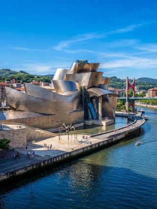 The Guggenheim Museum in Bilbao is a world-famous landmark of modern art, created by the architect Frank Gehry, with its wavy titanium exterior like a giant sculpture. Not only did it bring this industrial city in northern Spain back to life, it turned it into a classic example of urban rejuvenation. The visit here is not only simple to take pictures, but also experience the artistic atmosphere, architectural aesthetics and city charm at once.

Tour Route Recommendation:
From the Museo Plaza in the Abando area, it is recommended to start from the outside and slowly appreciate the exterior of the museum and take photos. After entering the museum, the first floor is mainly temporary exhibitions and themed installation art; the second floor is the permanent collection area, including the works of many important artists of the twentieth century; the third floor has international large-scale tour exhibitions from time to time, friends who like modern art remember to reserve time to visit one by one.

Must-see photo spots:
1. Art Gallery Wavy Exterior—The reflections of titanium blend perfectly with the surroundings, taking beautiful views of the city from different angles.
2. The large spider sculpture Maman in front of the entrance — full of tension and very shocking.
3. Riverside Walk next to the Art Gallery—The art gallery and the river are photographed across the bank, each with its own flavor day and night.

Playing Tips:
· The gallery has a built-in locker for large bags.
· Advance ticket purchase is recommended to save waiting time for entry.
· Security check is required for entry, liquid drinks cannot be brought into the museum.
· There is a restaurant Cafe in the museum, where you can feel the artistic atmosphere while eating.
· For an in-depth understanding of the exhibits, it is recommended to rent an audio guide (mainly in English and Western).

Notes:
· Open all day (10:00-20:00) Monday and Wednesday through Saturday;closed Tuesday;10:00 a.m. to 3:00 p.m.
· It is recommended to avoid weekend rush hours for less crowds and more comfortable photography.
· Outdoor views are free.

Conclusion: The Guggenheim in Bilbao is a must-see for art, architecture and urban vibrancy, don’t miss every photo spot and exhibit.

Bilbao Art Tour Which exhibit would you most like to see? #Guggenheim #Bilbao #UrbanRevival #PhotoHotspots #SpainTravel