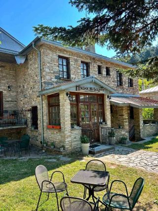 #easytravelpost 

If you are looking for a destination that perfectly embodies the idea of easy and relaxed travel, the alpine village of Nymfaio (Nymphaio) in Northern Greece is an ideal choice. Perched at an altitude of 1,350 meters on Mount Vitsi (in the Florina region), this stone-built settlement has been recognized by UNESCO as one of the ten most beautiful villages in Europe.

Here is why a trip to Nymfaio offers a true "easy travel" experience:
🚶♂️ Everything is within walking distance (Zero traffic stress)
In Nymfaio, cars are strictly prohibited inside the settlement. You leave your vehicle at the organized parking lot right at the entrance of the village. This means that once you arrive, your only mode of transport is your own two feet. The village is compact, quiet, and tailor-made for slow strolls along cobblestone alleys, past magnificent stone mansions and restored architecture.
 🐻 Easy and relaxing activities
You do not need complicated itineraries or heavy gear to enjoy this place. Everything is set up for mindful relaxation:

· The Arcturos Bear Sanctuary: A flat, beautiful 1.5 km walk through a lush beech forest leads you to this famous environmental center, which protects rescued brown bears and wolves. The trail is gentle and accessible for all ages.
· The Museum of Gold and Silversmithing: Located right in the center of the village inside the stunning, castle-like Nikeios School, where you can easily learn about the rich history of the local craftsmen.
· Nature on your doorstep: For a low-effort day trip, the scenic lakes of Zazari and Cheimaditida are just a short drive down the mountain, offering peaceful views and birdwatching.

 ☕ Comfort food without the fuss
By definition, easy travel means great food that is easy to find. The traditional stone taverns and cozy cafes lined up around the main square serve hearty local Macedonian and Vlach dishes:

· Try "Neveska", a traditional baked dish made with layers of potatoes, pork, and melted local cheeses.
· Sip on award-winning local wines from the nearby Amyndeon (Amyntaio) wine region, famous for its Xinomavro grapes.

Nymfaio is easily reachable by car from Thessaloniki (around 2 hours) or from the North Macedonia border (via Bitola/Niki, under an hour), making it the perfect weekend getaway where your only responsibility is to slow down, breathe the crisp mountain air, and unwind.

