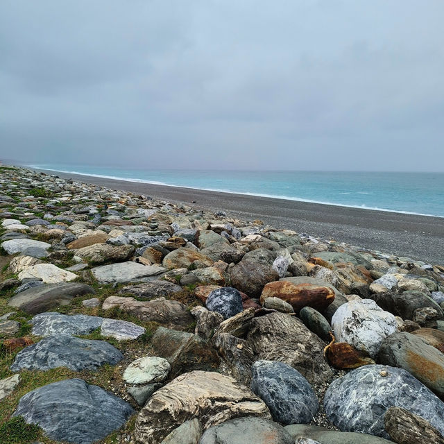 Escape to the pristine shores of Qixingtan Beach, where the mountains kiss the ocean