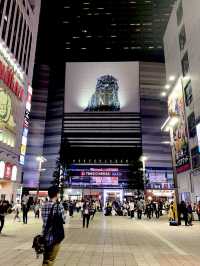 Godzilla and the bustling street of Shinjuku