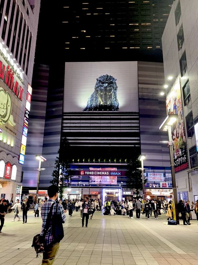 Godzilla and the bustling street of Shinjuku
