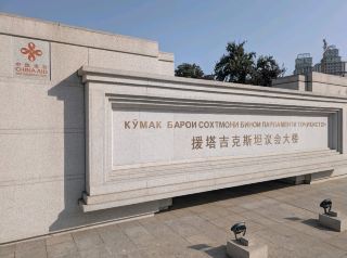 A Jaw-Dropping Slice of Silk Road Magic in Tajikistan 🇹🇯✨  
From stunning white-domed architecture to emerald lawns tucked under blazing sunshine, Tajikistan isn’t just about jaw-dropping landscapes—its genuine warmth and friendly locals make every corner an instant welcome. Whether you’re wandering outdoor cultural icons or soaking in stylish Western-influenced pillars, this is a spot that feels as comfortable as it looks magical.

🌳 Recommended Route:  
Start your exploration in the heart of Dushanbe, where impressive white buildings with grand domes and stately pillars rise over lush green grounds. Stroll through the outdoor spaces—perfect for relaxing among trees and soaking in the vibrant surroundings.

📸 Top Insta-Worthy Angles:  
Stand across the lawns early in the morning to catch the sun sparkling on the dome, with the building framed by leafy trees for classic Western architectural vibes. A close-up of the columns and façade pops in bright daylight!

⭐ Must-Do Experiences:  
Take your time to admire the building’s intricate design up close, enjoy a peaceful picnic on the grass, and chat with locals—Tajik hospitality is part of the magic!

🔎 Practical Tips:  
Visit on sunny days for those golden-hour shots. Dress modestly and comfortably for the relaxed but culturally respectful vibe. The area’s best explored on foot; it’s safe, calm, and full of photo opportunities.

⚠️ Key Precautions:  
Always ask before photographing locals. Hydrate well—even shady lawns get warm during summer! Respect cultural etiquette for dress and behavior.

#Tajikistan #SilkRoad #Architecture #TravelNotes #FriendlyLocals