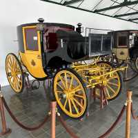 A museum filled with coaches on exhibits