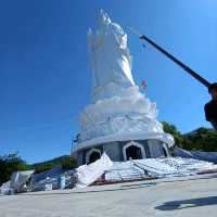 Peace and tranquility beside a giant Buddha.