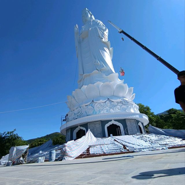 Peace and tranquility beside a giant Buddha.