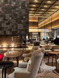 A lobby lounge with a fireplace🥂