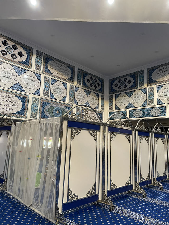 The mosque features intricate Islamic calligraphy 