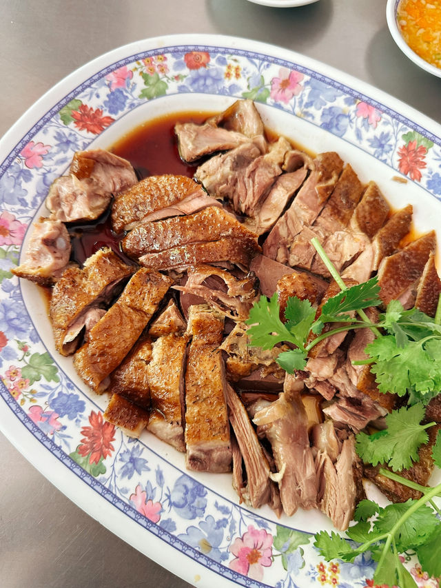 Sliced braised goose in dark soy broth at Urai Braised Goose