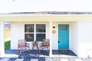 A Blue Kitchen, Navy Bedroom, and Private Patio at Uptown Peach