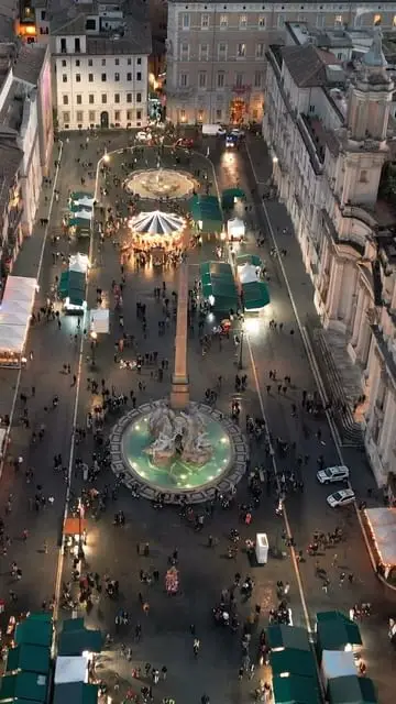 "Christmas Enchantment at Piazza Navona: Step into the Festive Splendor of Rome, Where Joy Paints the Streets! 🇮🇹🎅✨