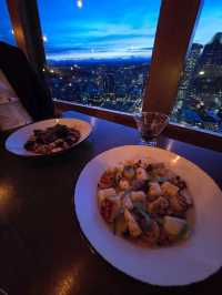 Dinner with a view... that moves. 🌆🍷