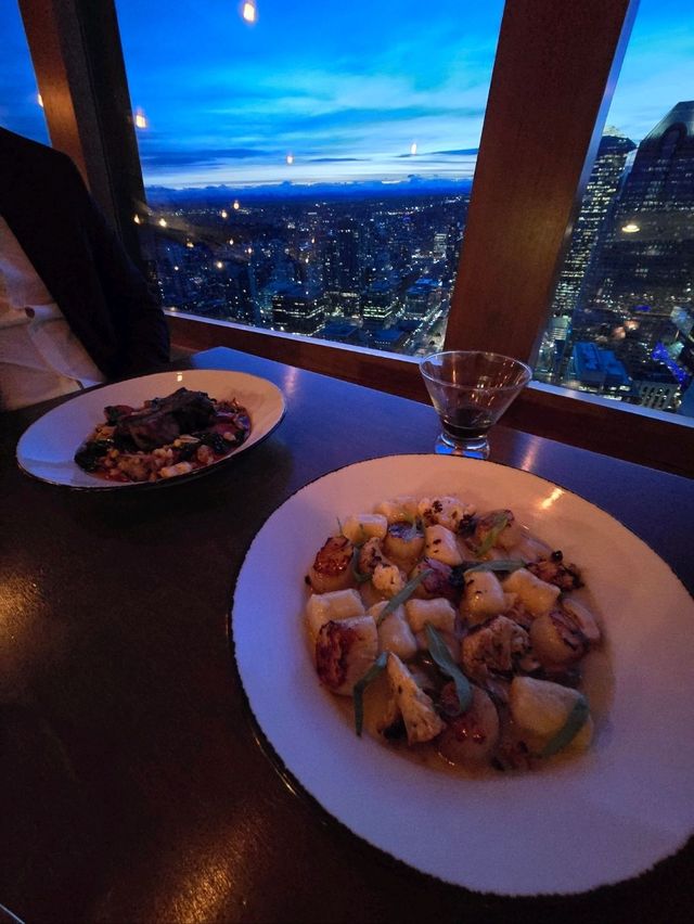 Dinner with a view... that moves. 🌆🍷