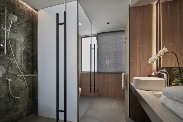 Spacious bathrooms with premium toiletries, rain showers, and some rooms offering bidets.