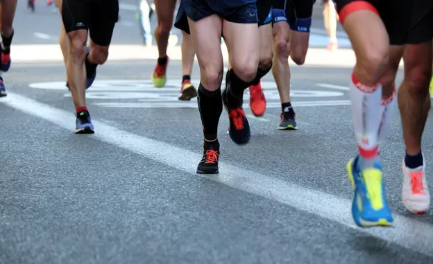 Closeup of people running in a marathon