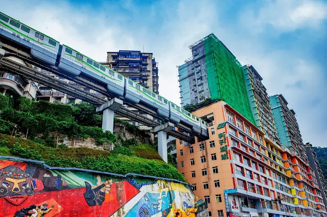 Chongqing Liziba metro station; train passing through a residential building