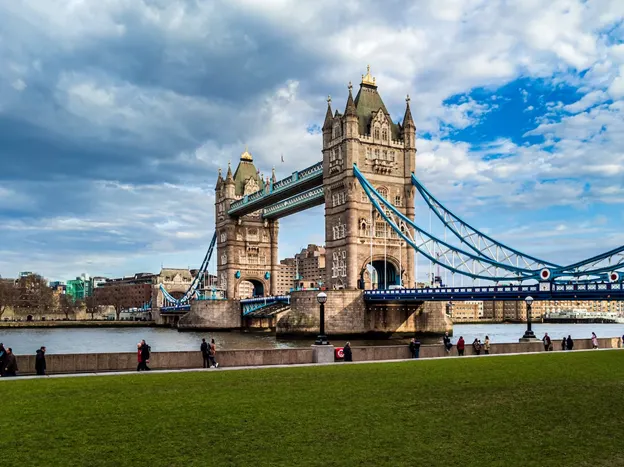 The Tower Bridge in London with clouds in a blue sky