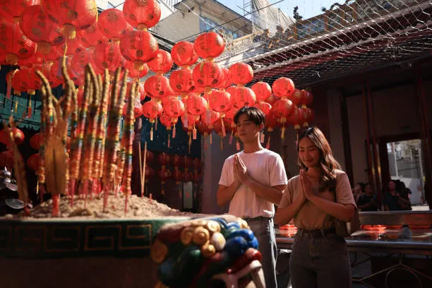 A couple prays at a temple