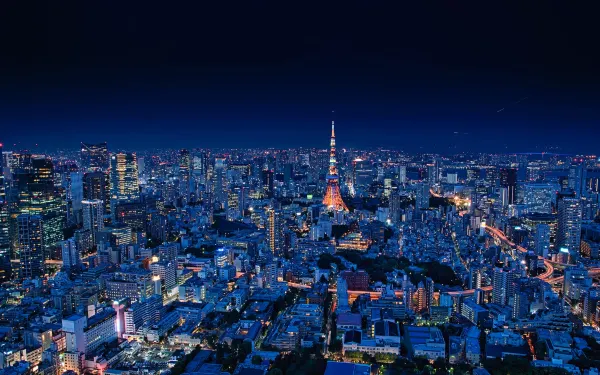 Tokyo Tower and surrounding cityscape at night. Source: Photo by Takashi Miyazaki / unsplash.com