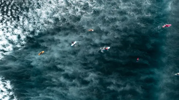 Surfers at the Baby Reef in Sanur Beach, Bali. Source: Photo by Mario von Rotz / unsplash.com.