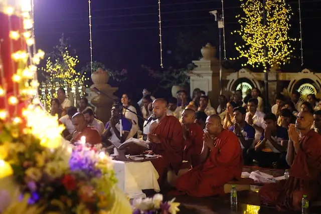Buddhist monks in prayer at a temple in Sri Lanka